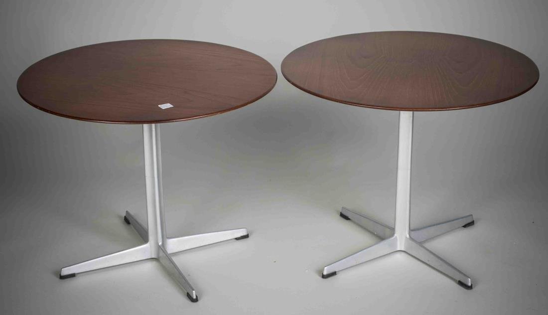 Pair of Arne Jacobsen for Fritz Hansen Low Tables: Each with circular top on a four pronged aluminum base. Marked Fritz Hansen. Height 18 inches, diameter 23 inches. <