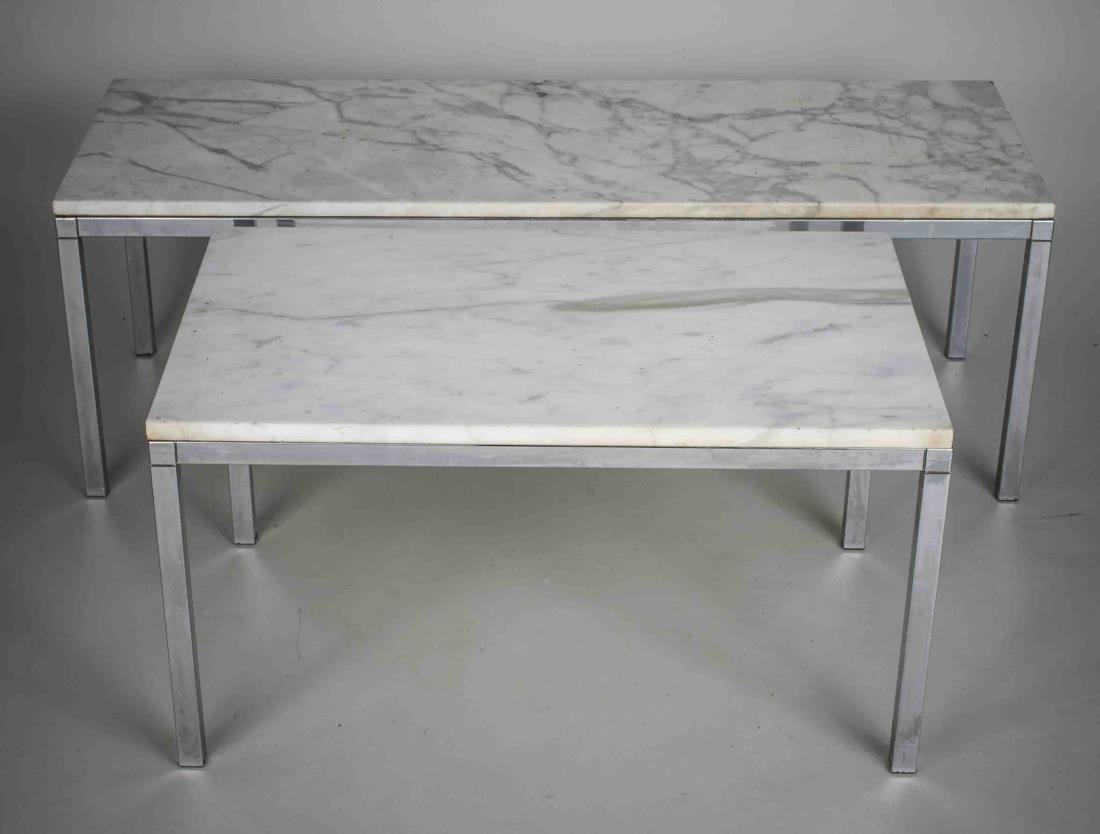 Set of Two Marble Top Chrome Tables: Comprising a coffee table and a side table each with a black marble top on a chrome base. Coffee table, height 16 inches, width 46 inches, depth 16 inches.