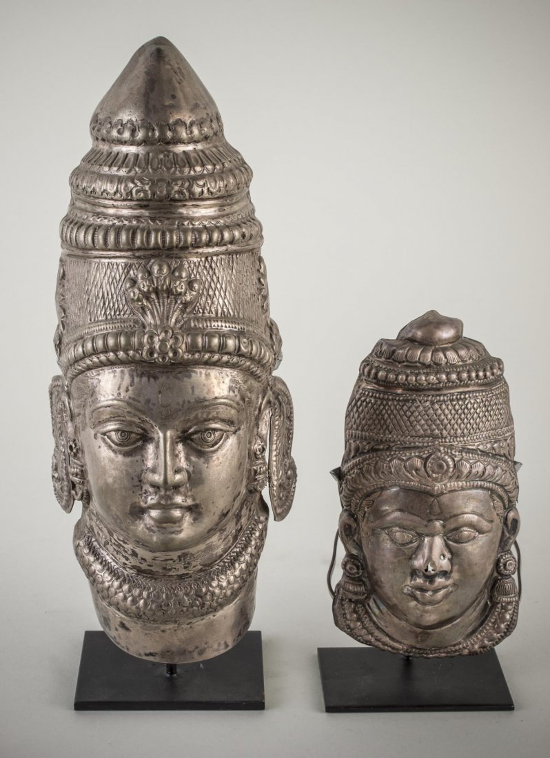 Two Nepalese Silver Masks: Each mounted on stand. Taller height 12 inches.