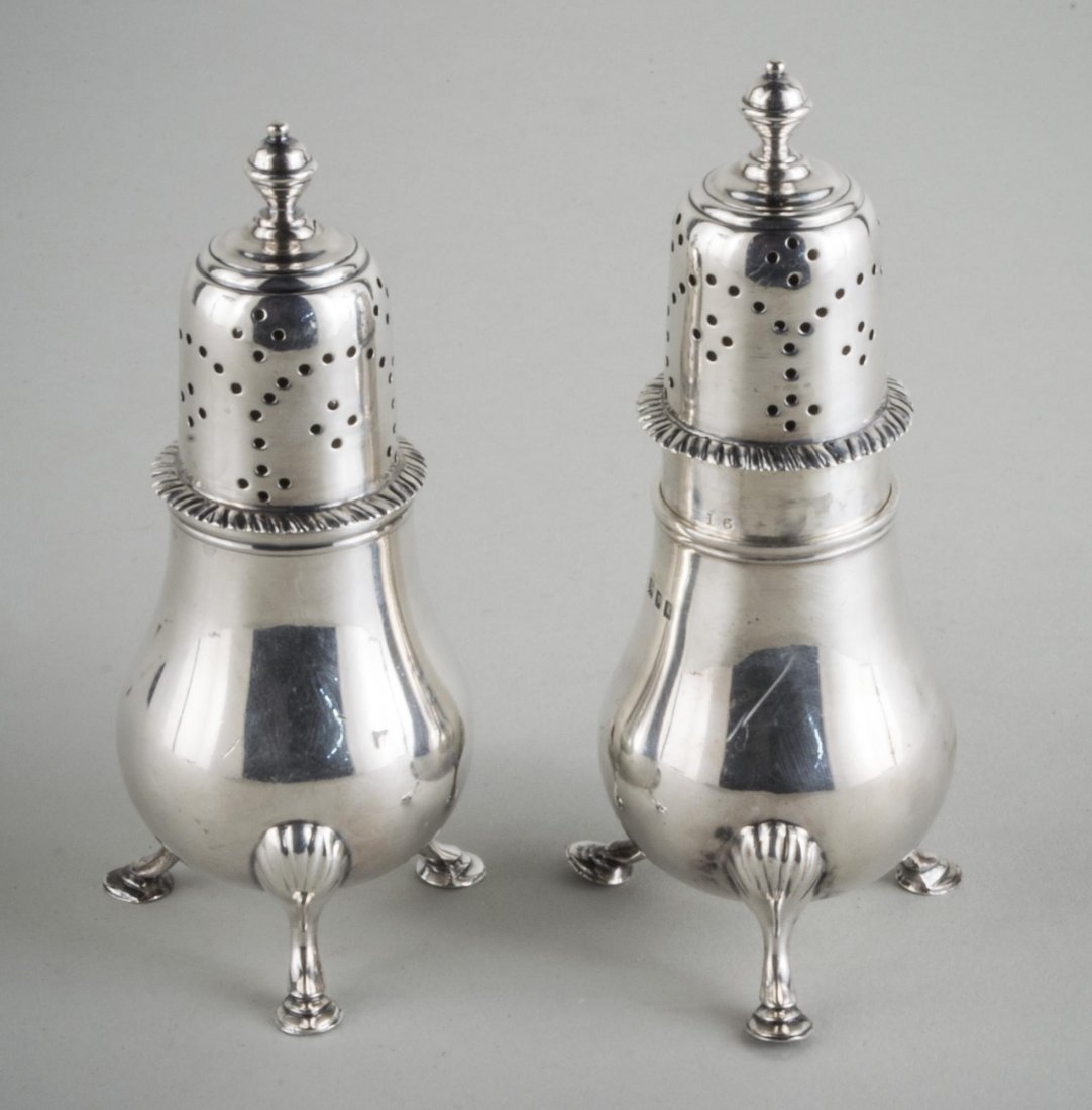 Pair of English Silver Shakers: London, 1910, maker's mark of baluster form with hoof feet. Height 4 1/2 inches, total 200 grams.