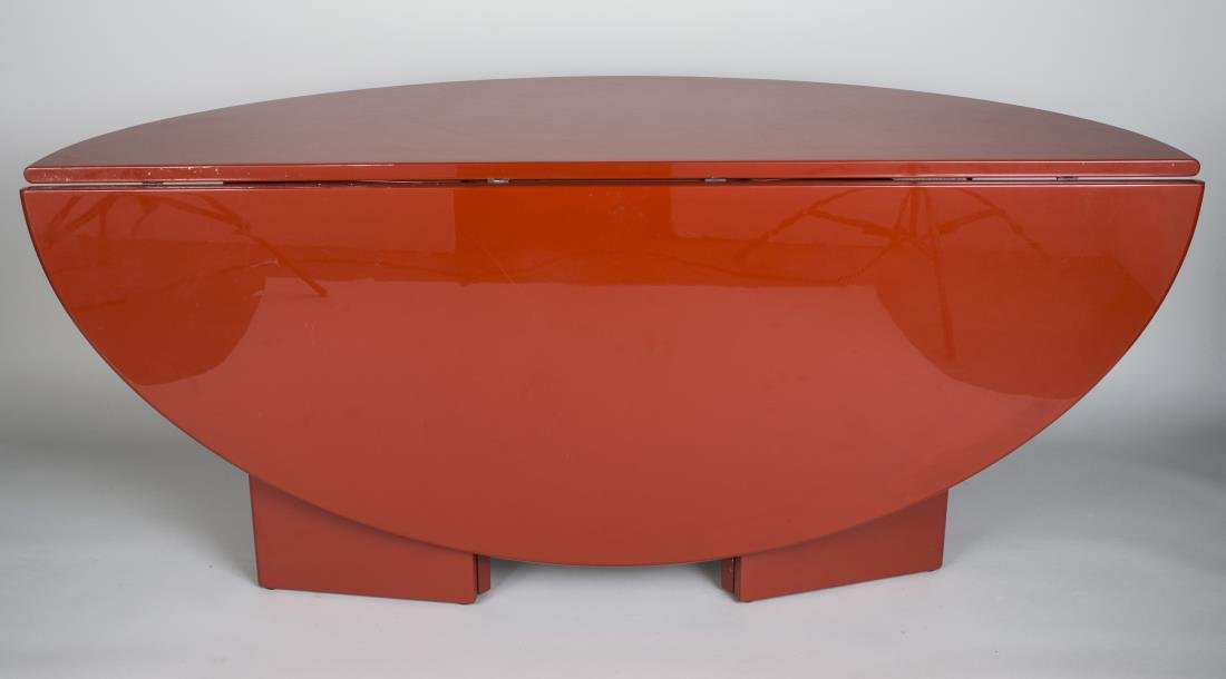Contemporary Red Lacquer Drop Leaf Table: Circular top on panel pedestals. Height 29 inches, width 5 feet 6 1/2 inches, depth 48 inches.