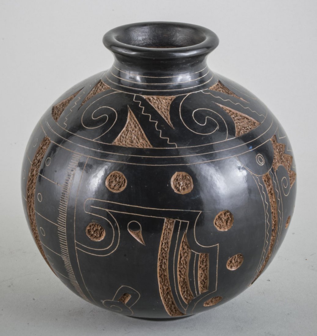 Roger Calero Pottery Vase: Globular vase with carved geometric decoration, signed. Height 6 1/4 inches.