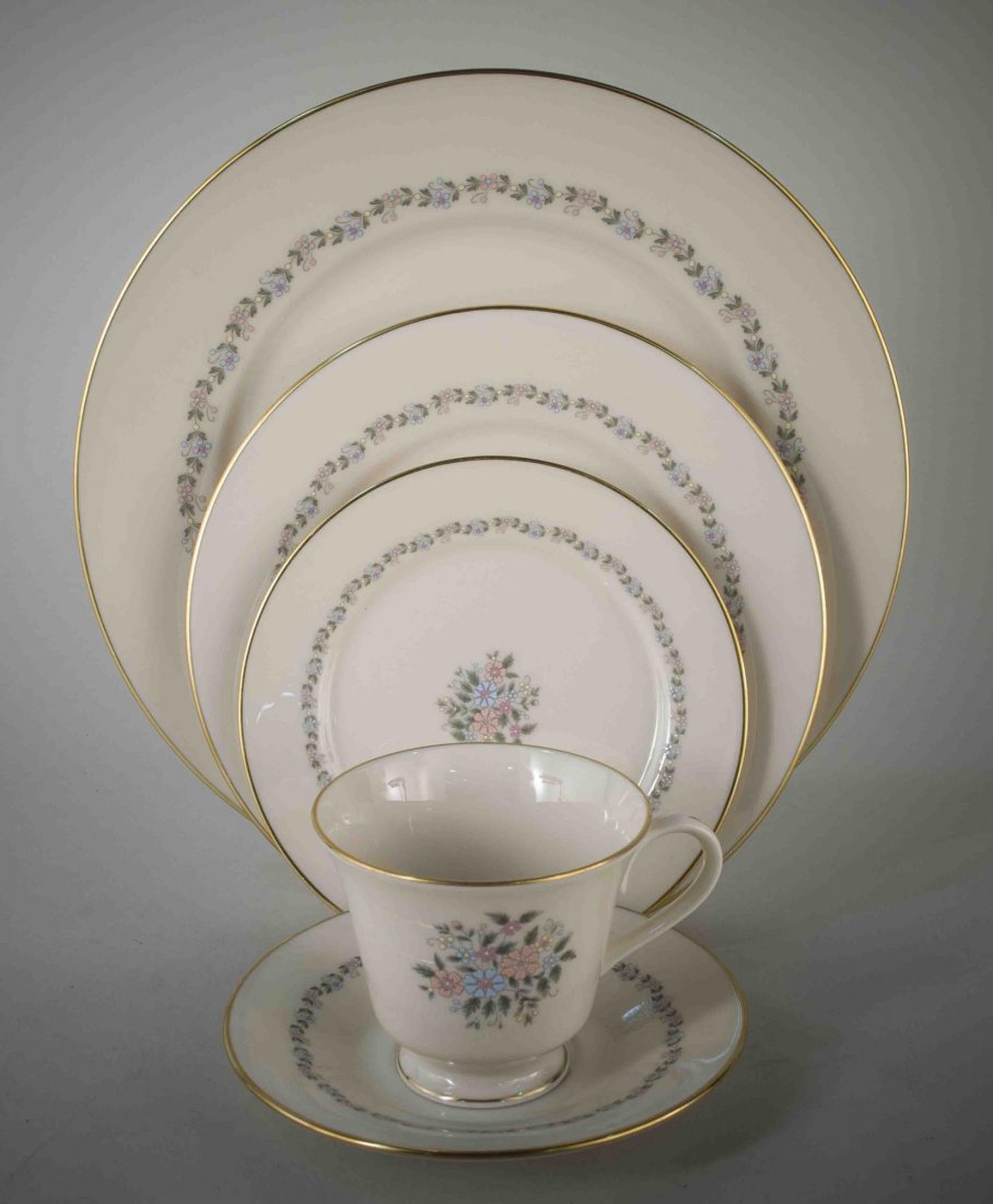 Lenox Porcelain Dinner Service: Christie pattern, comprising eight dinner plates, eight salad plates, eight bread plates, eight cups and saucers, two bowls, platter, saucer boat, cream and sugar. Dinner plate diameter 10 3/4 inches.