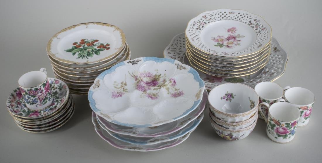Group of Porcelain Table Articles: Including nine KPM dessert plates, four French oyster plates, German dessert set, etc. Platter diameter 10 1/2 inches.