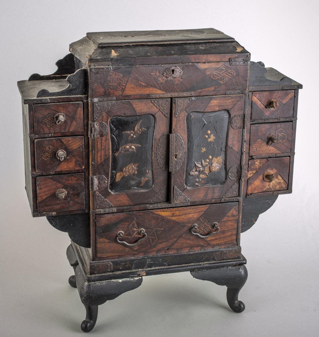 Asian Lacquer Tabletop Cabinet: Central two door cabinet with a drawer above, below and flanked by drawers on each side. Height 17 1/4 inches, width 16 1/4 inches, depth 6 1/2 inches.