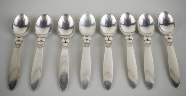 Georg Jensen Coffee Spoons: Set of eight 'Cactus' pattern coffee spoons and a pair of Jensen sterling salt cellar spoons.