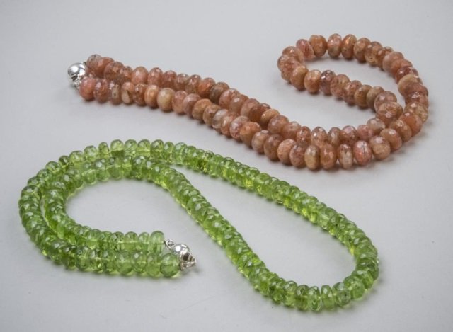 Two Faceted Bead Necklaces: One sunstone beads, silver clasp, length 18 inches, and the other, peridot faceted beads, silver clasp, length 19 inches.