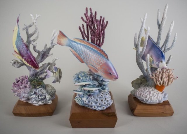 Three Royal Worcester Porcelain Fish Sculptures: Including a Rainbow Parrotfish numbered 131/500, a Spanish Hog-fish and Sergeant Major Fish numbered 170/500, and a Blue Angelfish numbered 109/500, each on wood base and with a stand up certificate o