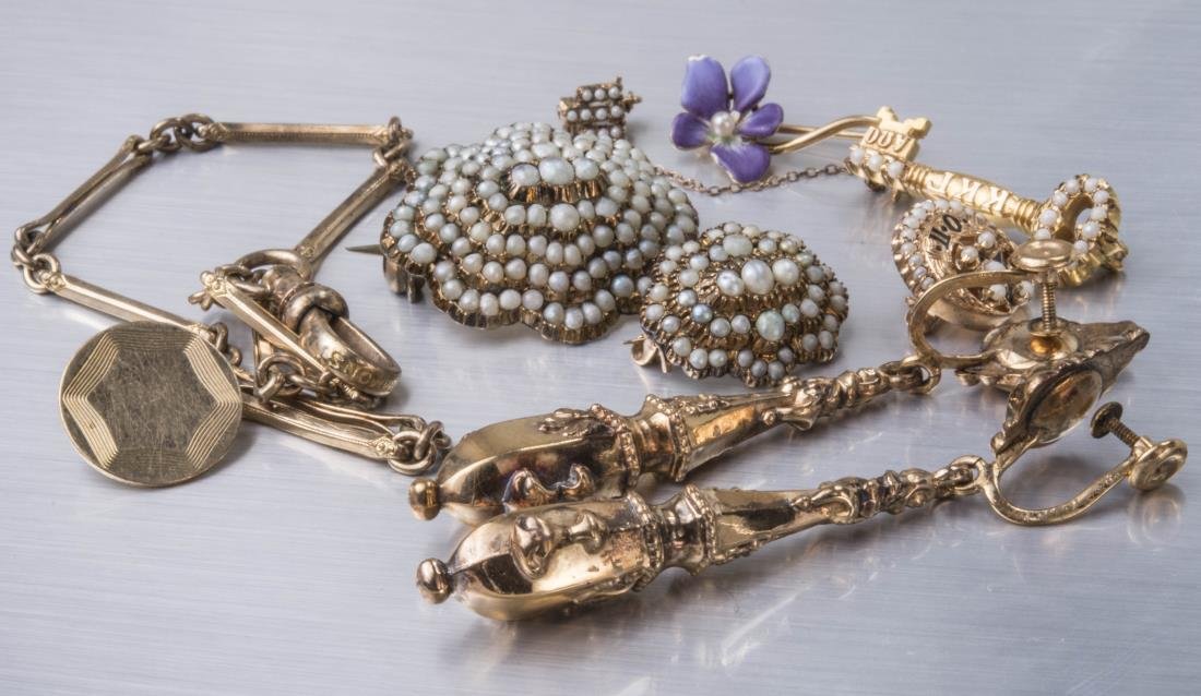 Group of Vintage Jewelry: Including a 14k yellow gold and enamel flower pin, two seed pearl pins, gold filled watch chain, three sorority pins, gold filled earrings.