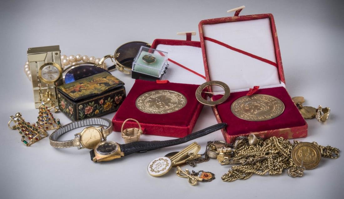 Group of Costume Jewelry: Necklaces, pins, two Asian bronze medallions, Police sunglasses, etc.