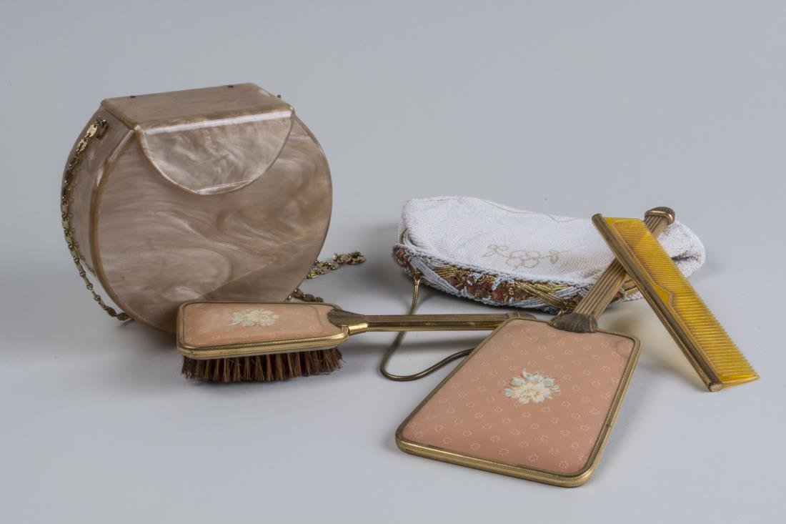 Dresser Set and Two Vintage Purses: Comb, hair brush and hand mirror; together with a simulated mother of pearl purse and a beaded purse.