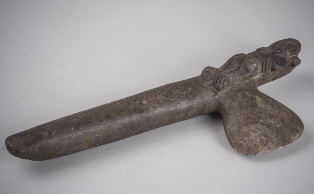 Native American Stone Hatchet: With beaver motif. Length 12 inches.