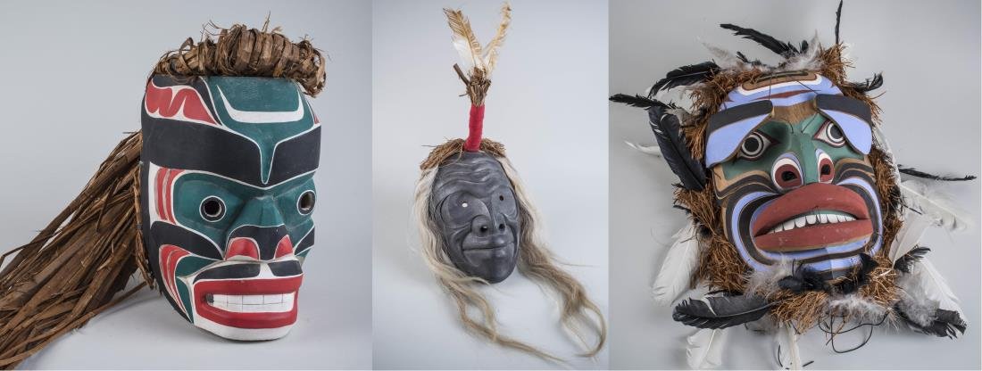 Three Native American Masks: (1) Attributed to Lyle Campbell (Haida Nation, b. 1969). Wood, paint, and hay, 1989. Signed and dated (interior). Mask height 11 3/4 inches. (2) Thompson (unknown). Wood, paint, hay, feathers and hair
