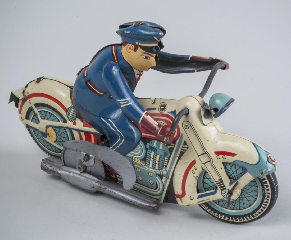 Vintage Line MAR Wind Up Tin Motorcycle Toy: Depicting a uniformed police officer on a motorcycle. Height 4 1/2 inches.
