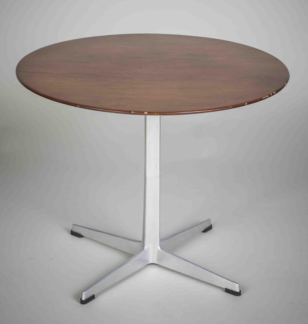 Arne Jacobsen for Fritz Hansen Low Table: Circular wood top on four pronged aluminum base. Marked Fritz Hansen on base. Height 18 inches, diameter 23 inches.