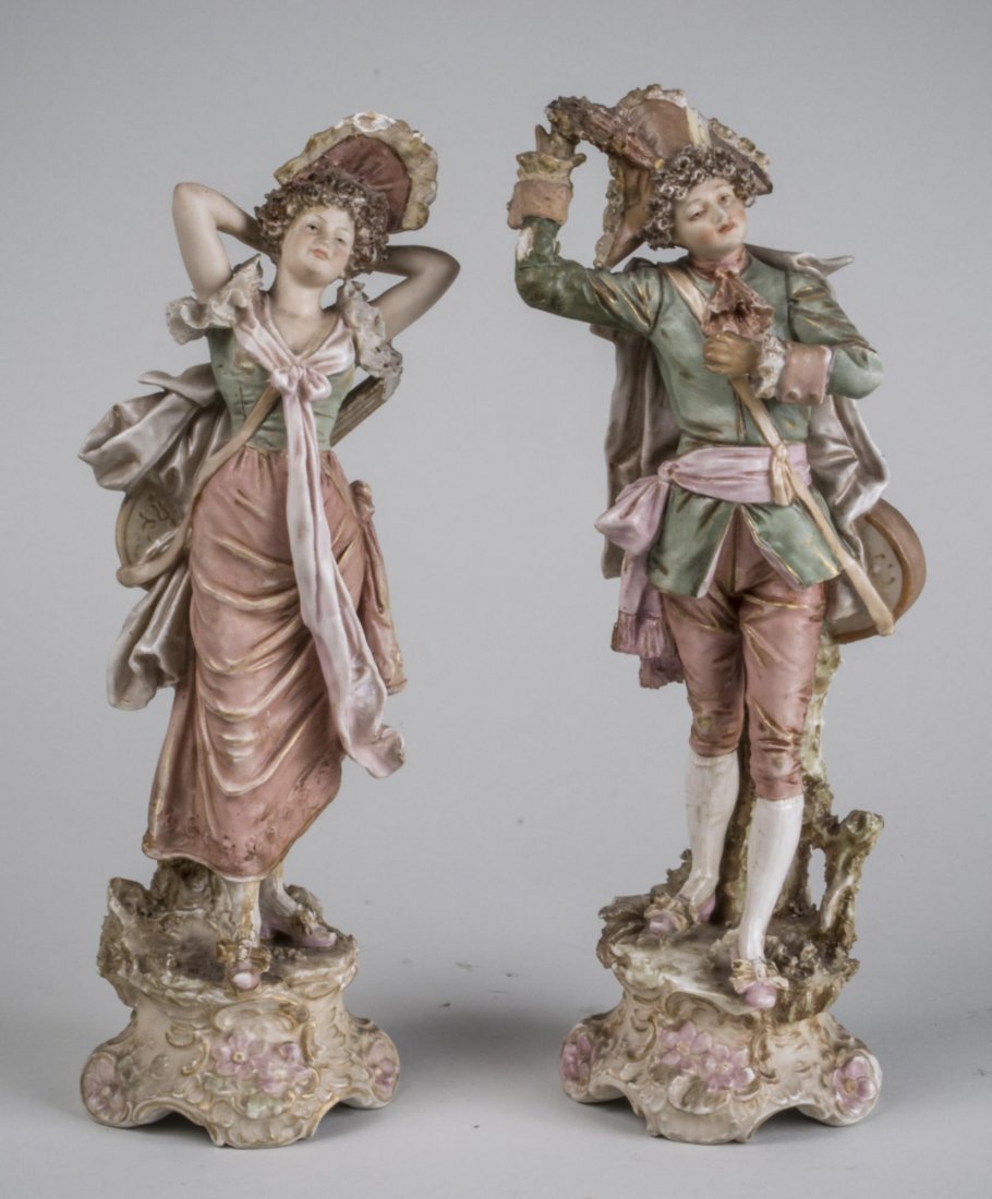 Pair of Royal Dux Porcelain Figures: A young couple in 18th century attire. Height 12 inches.