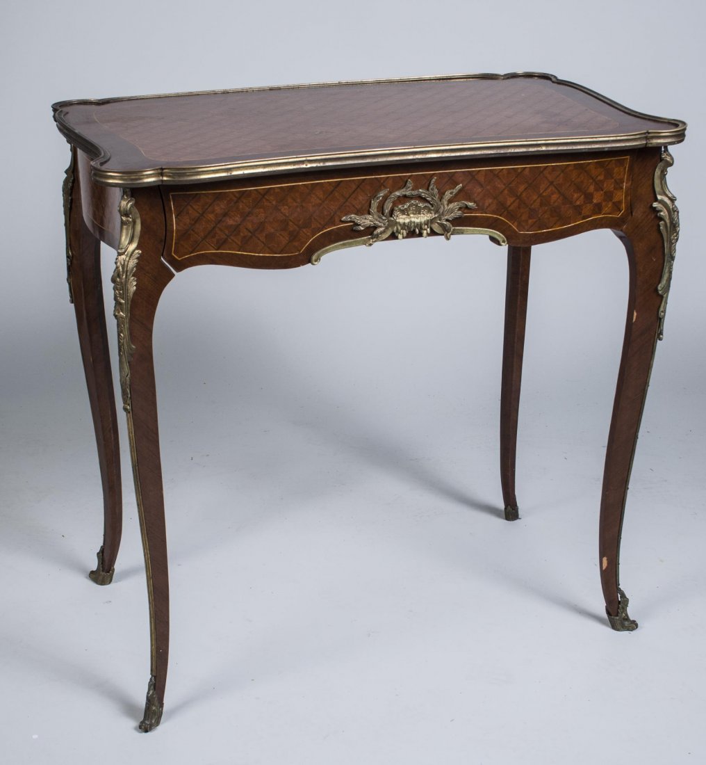 Parquetry Top Side Table: Rectangular top with outset corners, over one drawer, cabriole legs ending in brass casters Height 28 1/2 inches, width 29 inches, depth18 inches..