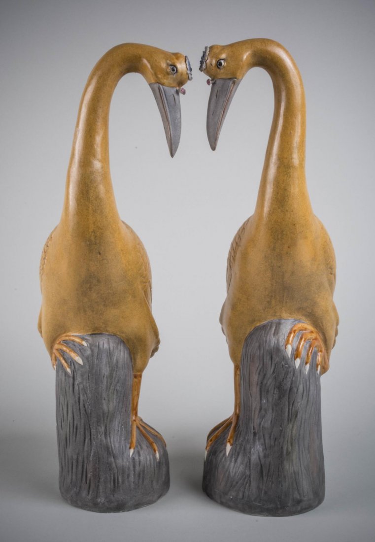 Pair of Chinese Porcelain Cranes: Modeled facing each other, standing on stumps. Each height, 20 inches.