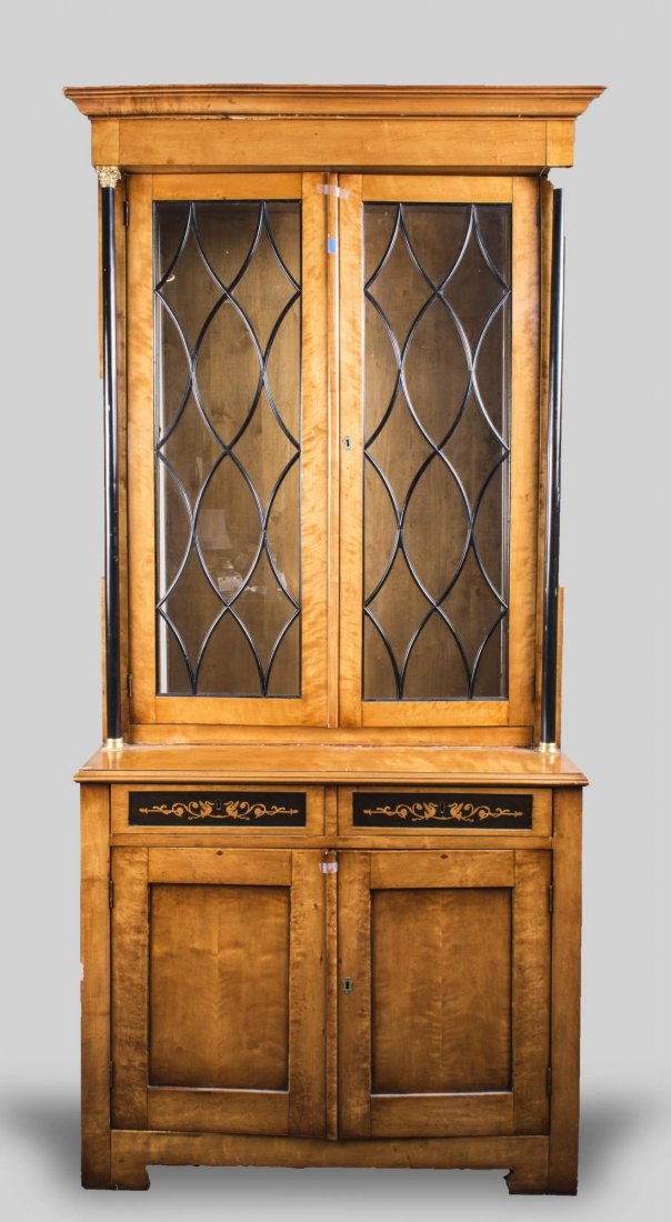 Biedermeier Cabinet: Molded cornice over two glazed doors above two short drawers and a two door cabinet. Height 7 feet 3 inches, width 40 inches, depth 20 inches.