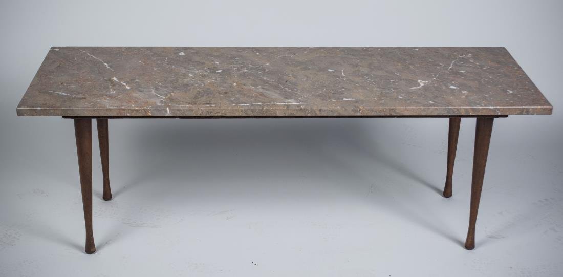 Marble Top Coffee Table: Rectangular top on four round tapered legs. Height 16 inches. width 46 inches, depth 16 inches.