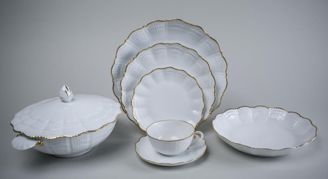 Limoges Porcelain Dinner Service: Approximately seventy-one peices. Retailed by Tiffany & Co., Giraud pattern, comprising twelve dinner plates, twelve salad plates, twelve soup bowls, twelve bread plates, eleven cups and twelve saucer