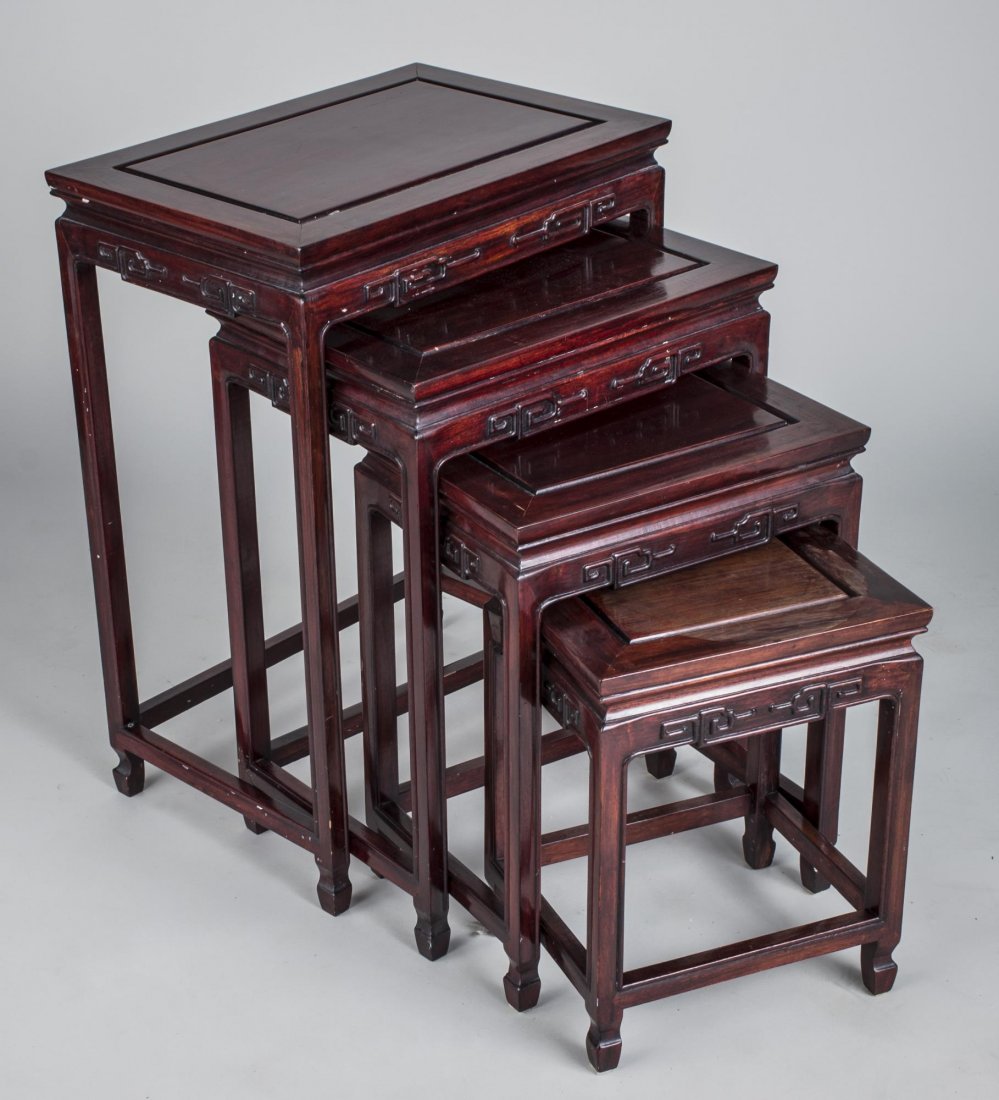 Chinese Nesting Tables: Each with rectangular top carved frieze, block legs joined by a box stretcher. Largest, height 27 inches, width 20 inches, depth 14 inches.