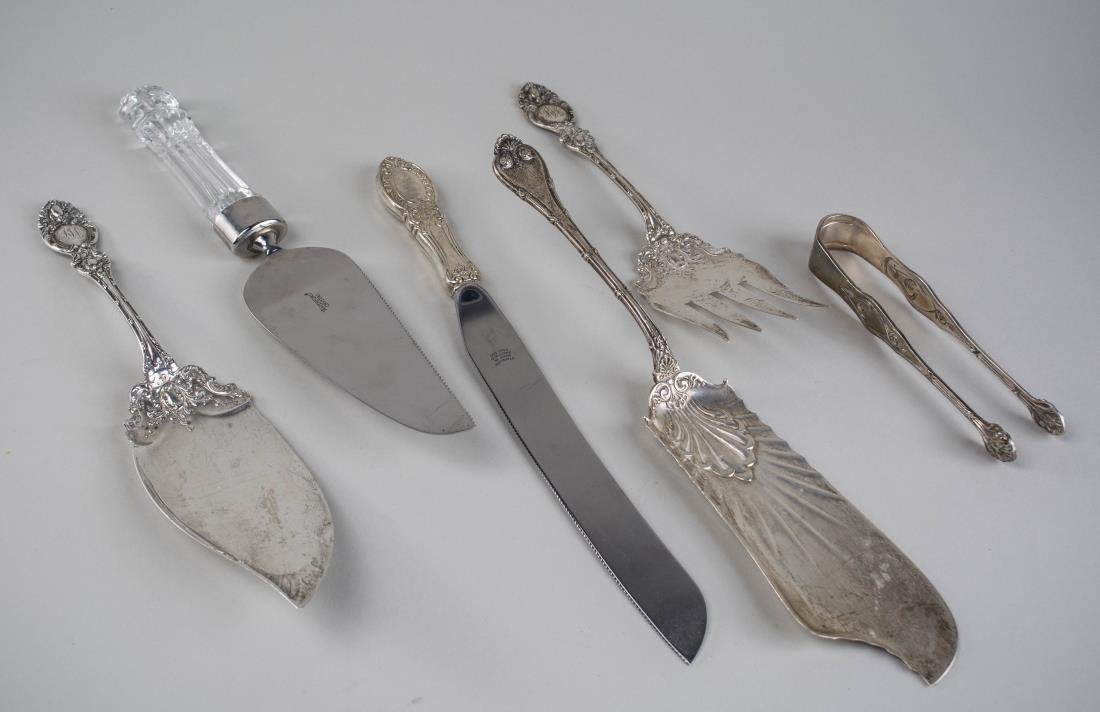 Group of Sterling Silver Serving Articles: Including a Wallace two piece fish serving set, Whiting fish slice, a sterling handled cake knife and a Waterford crystal handled cake knife. Total 330 grams, weighable, 10 ounces.