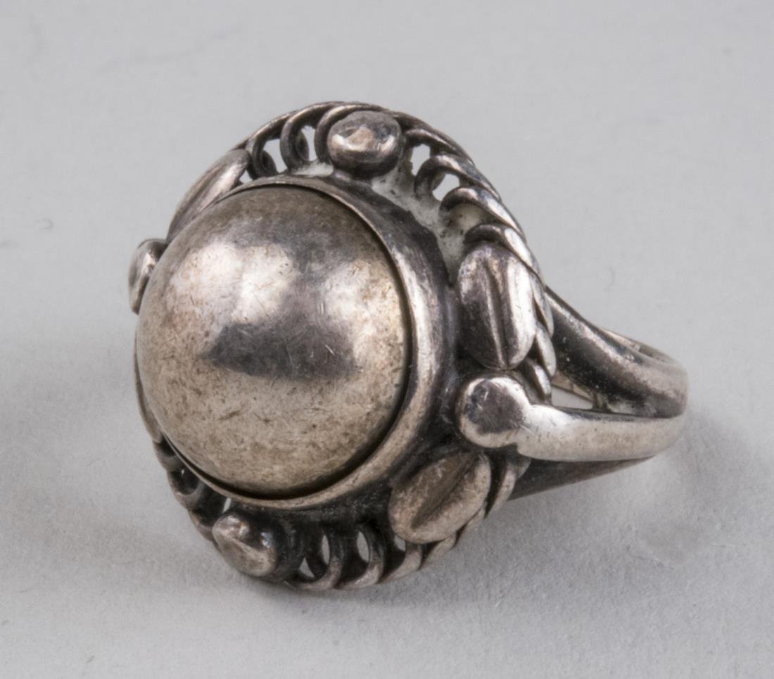 Georg Jensen Sterling Silver Ring: Marked Georg Jensen and Sterling Denmark, also marked 1 and C. 5.6 grams. Size 3 3/4.