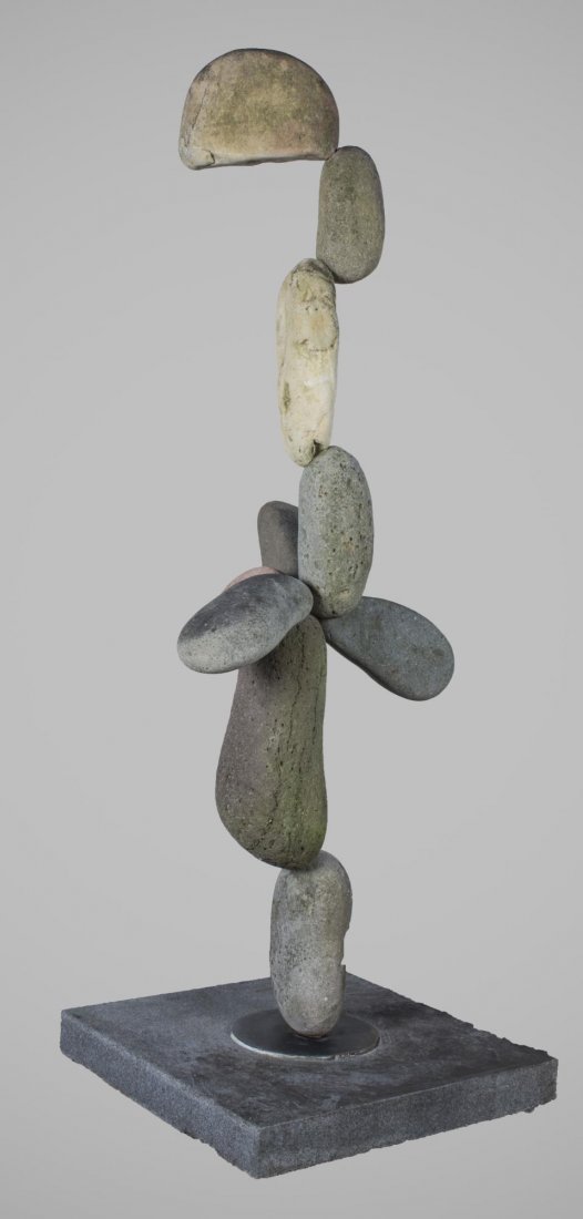 In the Manner of Andy Goldsworthy (Br., 1956): Untitled. Stone assemblage. Height 67 1/2 inches. On stone base.