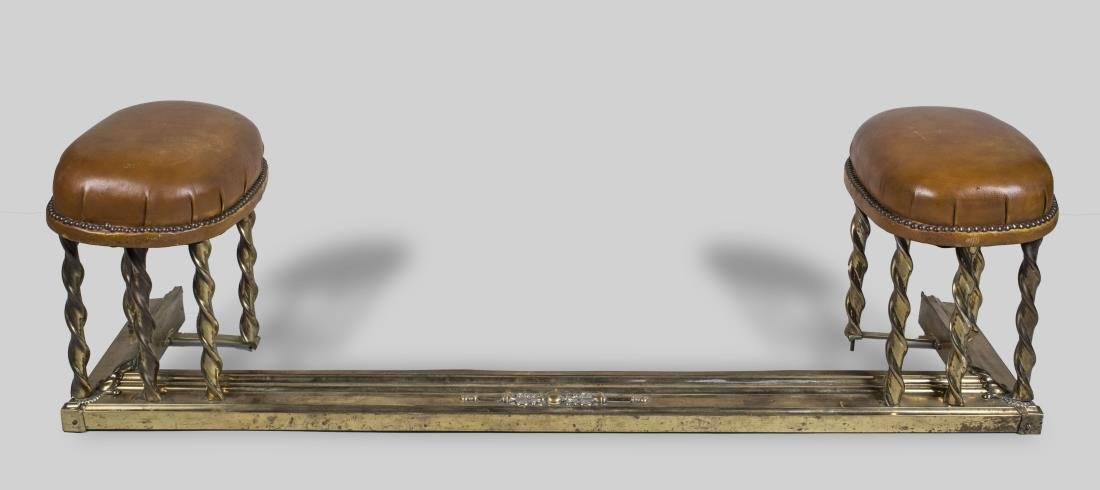 Brass Fireplace Fender: Two leather seats with nail head decoration. Height 16 inches, width 55 inches, depth 16 inches.