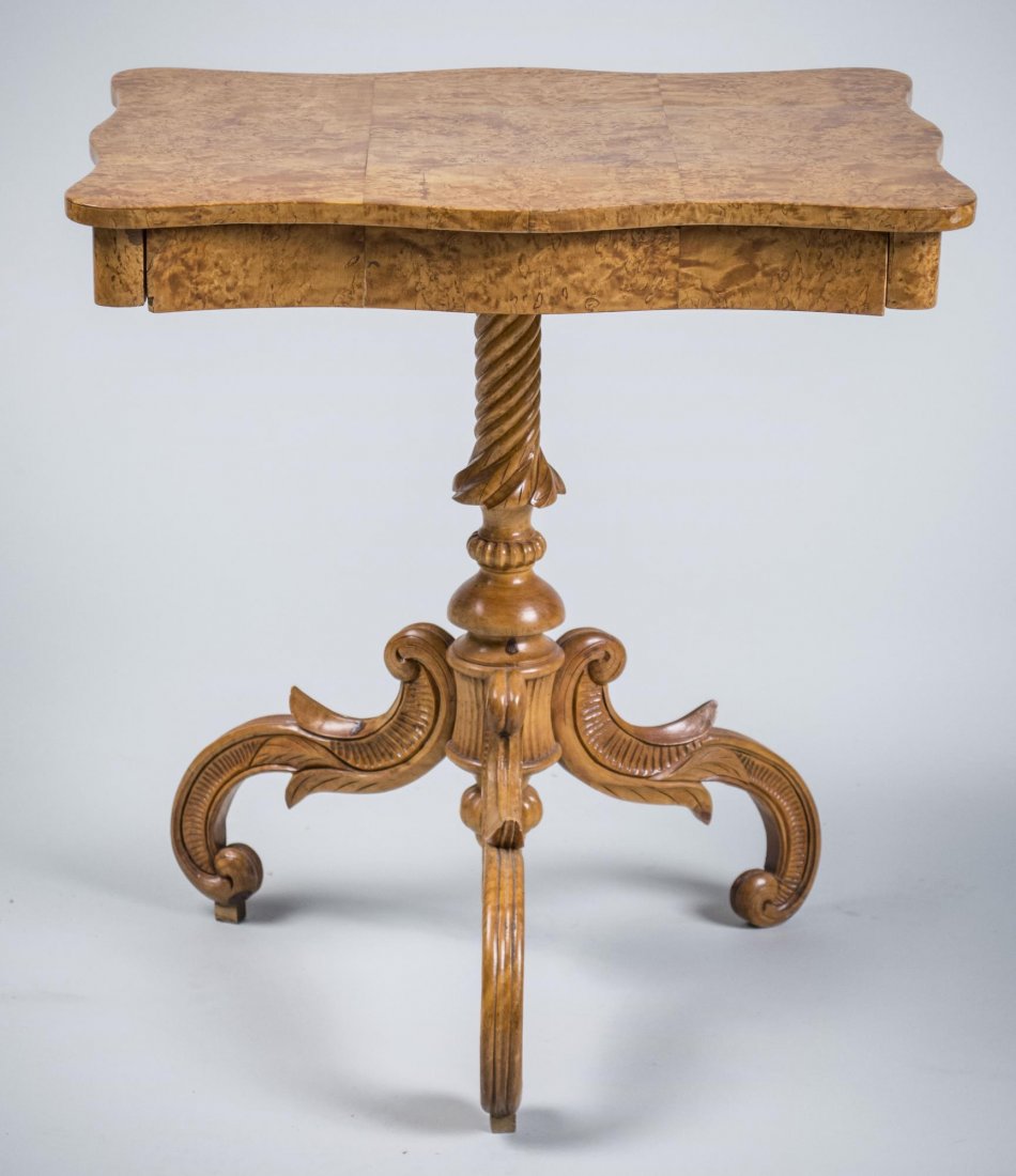 Biedermeier Side Table: Shaped rectangular top over a drawer on a turned column on scrolled legs. Height 21 inches, width 19 inches, depth 14 inches.