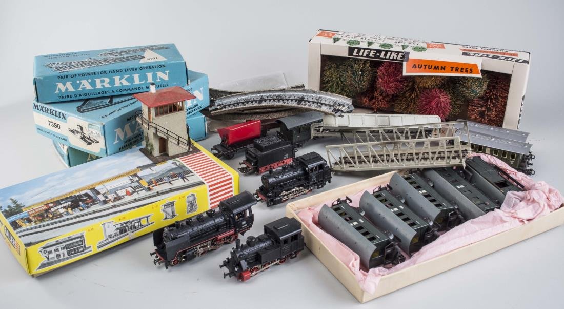 Collection of Vintage Marklin Trains: Including locomotives, passenger cars, tracks, controllers and scenery pieces. Notice to bidders: Condition reports and additional photographs are provided by request as a courtesy to our clients, as 