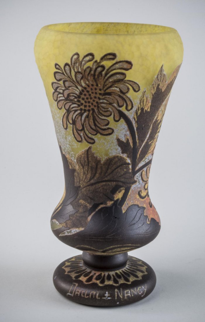 Daum Vase: Cameo glass vase, brown flowers on yellow ground, signed. Height 9 inches. Notice to bidders: Condition reports and additional photographs are provided by request as a courtesy to our clients, as such