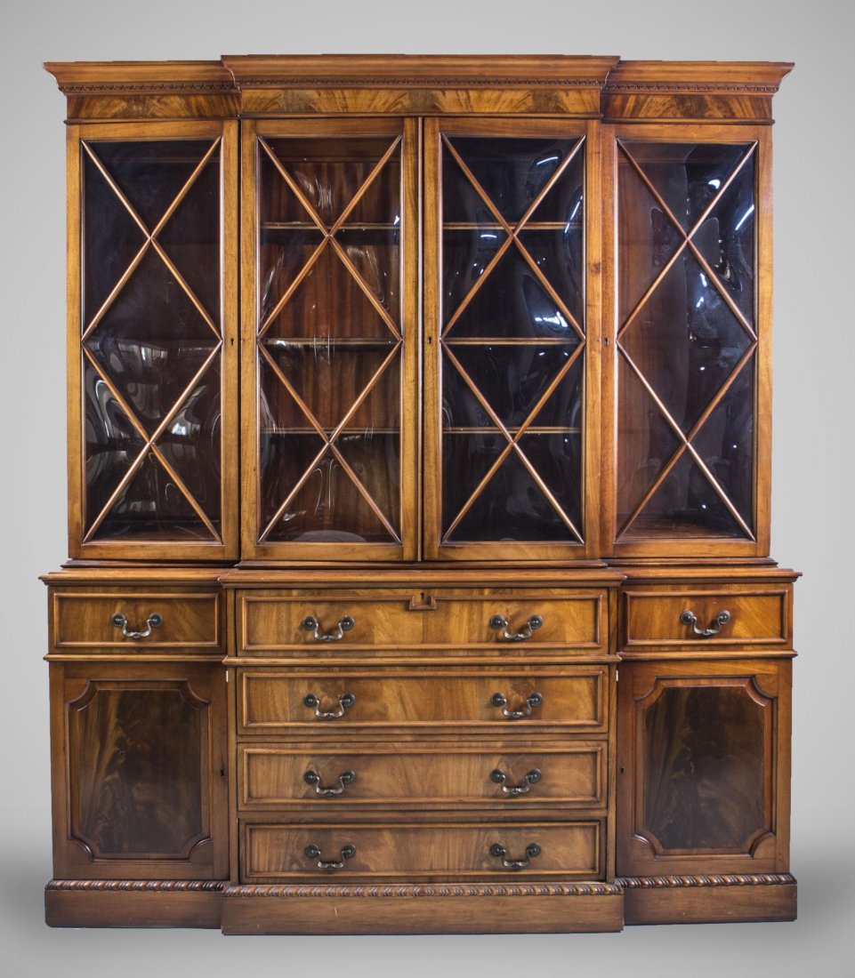 Georgian Style Fruitwood Breakfront: Molded cornice over four doors with convex panes of glass above a central bank of drawers flanked by cabinets. Height 6 feet 11 inches, width 6 feet, depth 19 inches. Notice to bidders: Condition repo