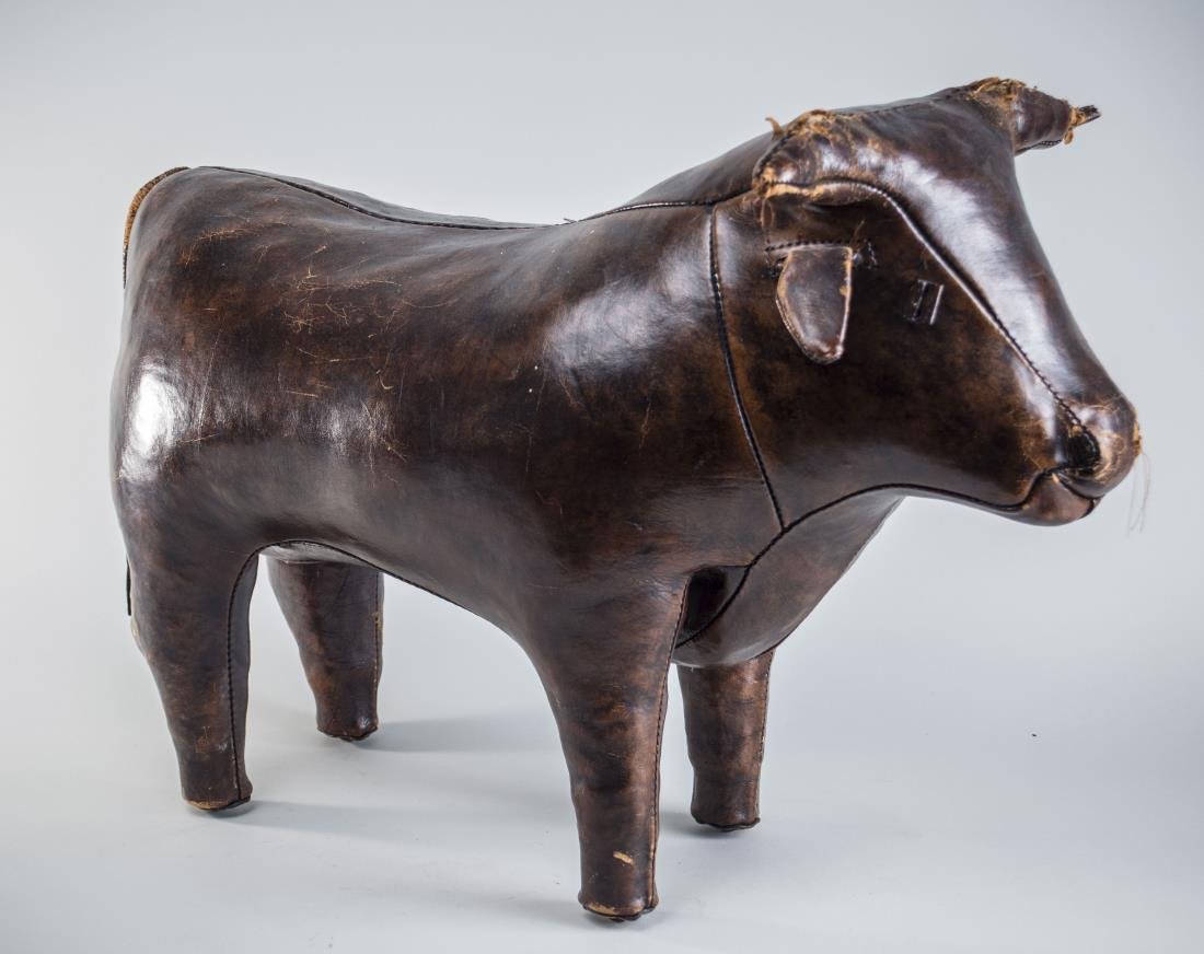 English Leather Bull Footstool: Modelled standing. Height 20 inches. Notice to bidders: Condition reports and additional photographs are provided by request as a courtesy to our clients, as such any condition report is only an opini