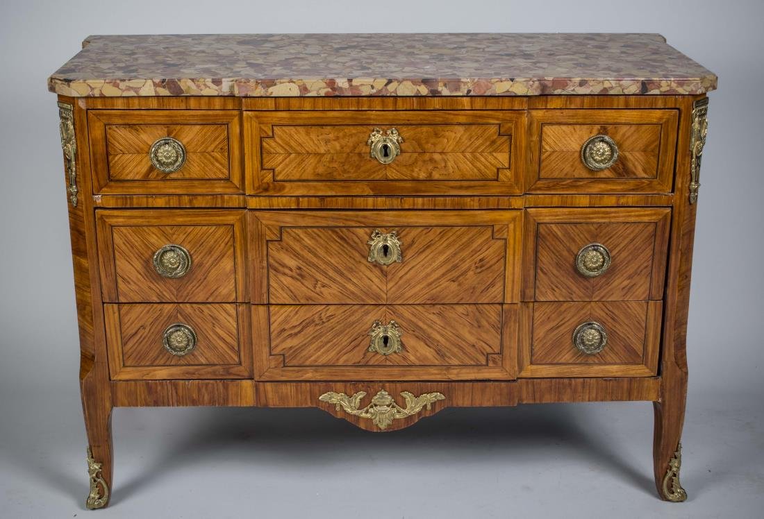 Louis XV -XVI Transitional Style Commode: Shaped rectangular marble top, over three drawers flanked by gilt metal mounted cut corners, slightly cabriole legs ending in sabots. Height 34 inches, width 48 inches, depth 21 inches. Notice to bidd