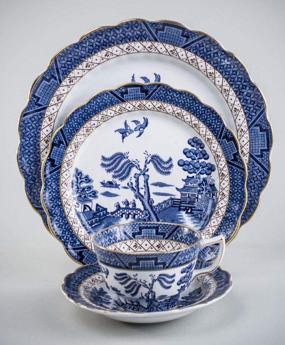 Booths Real Old Willow Service: Comprising seven dinner plates, ten luncheon plates, seven bread plates, eight fruit bowls, eight cups, four saucers, seven oversized saucers, and one oval serving platter. With two non-matching servi