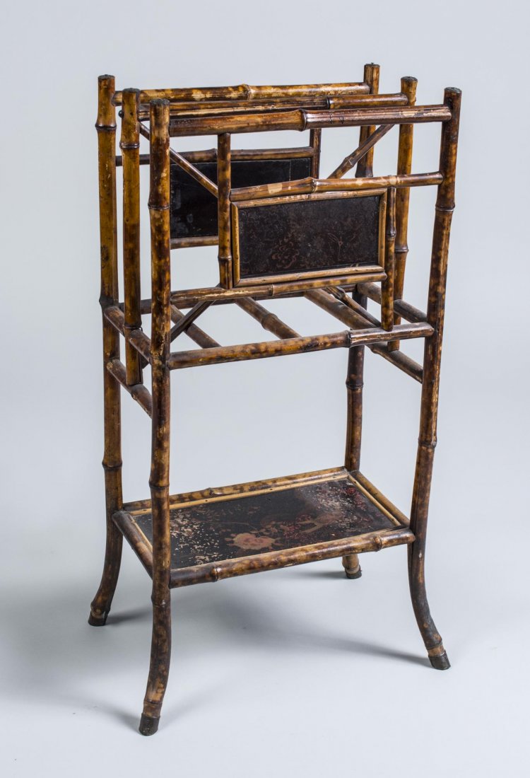 Regency Style Faux Bamboo Magazine Stand: Decorated with three lacquered panels with flowers. Height 33 inches, width 18 inches, depth 12 inches. Notice to bidders: Condition reports and additional photographs are provided by request as a cou