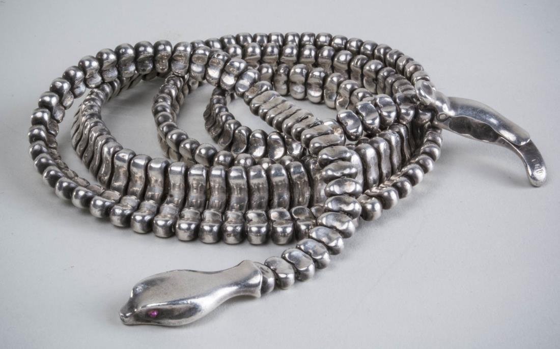 Elsa Perretti Style Sterling Chain Belt: Serpentine form. Length 34 inches, 230 grams. Notice to bidders: Condition reports and additional photographs are provided by request as a courtesy to our clients, as such any condition report is only