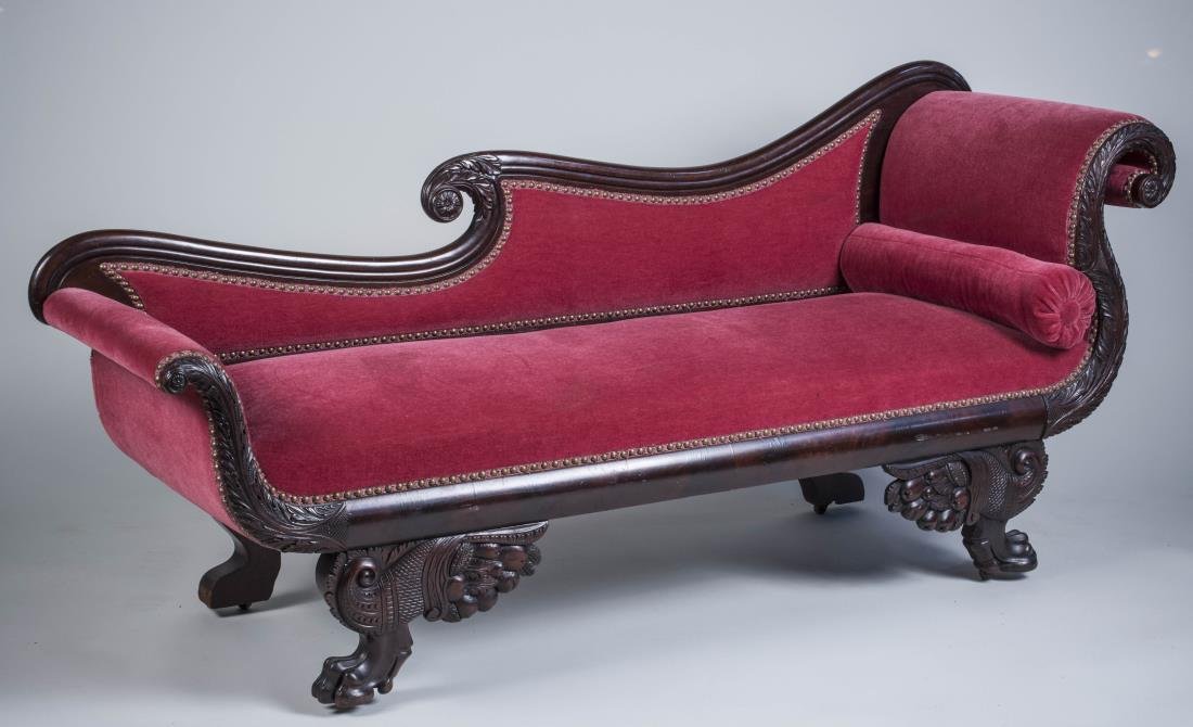 Classical Mahogany Chaise: Scrolled back with acanthus leaf decoration, fruit carved scrolled legs ending in animal paw feet. Height 33 inches, width 6 feet, depth 23 inches. Notice to bidders: Condition reports and additional