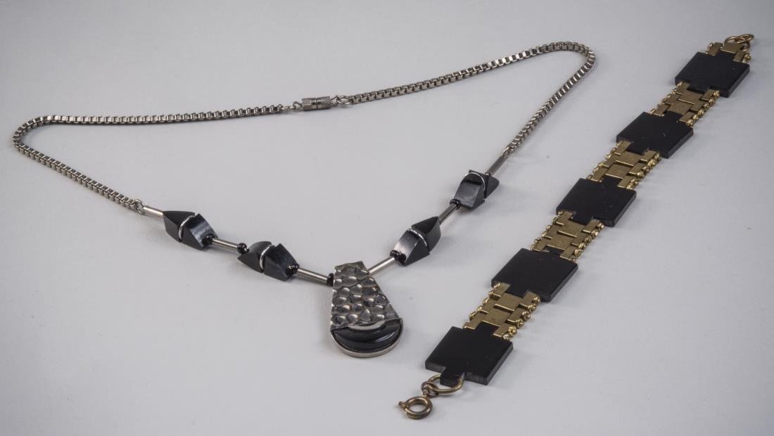 Three Jakob Bengel Jewelry Articles *: Circa 1930, one, a galalith and chrome pendant necklace, a brass and galalith bracelet and another metal bracelet. Necklace, length 16 inches, bracelet, length 7 inches. Notice to bidders: Condition r