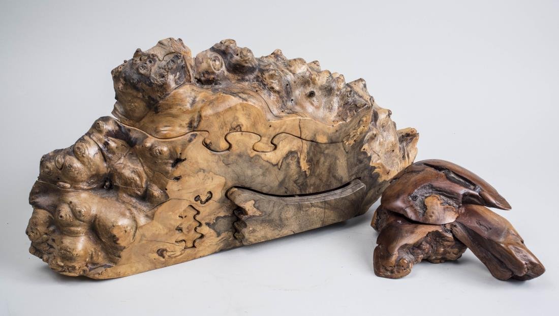 Two Richard Rothbard Wood Puzzle Boxes: Natural form. Taller height 10 3/4 inches. Notice to bidders: Condition reports and additional photographs are provided by request as a courtesy to our clients, as such any condition report is only an