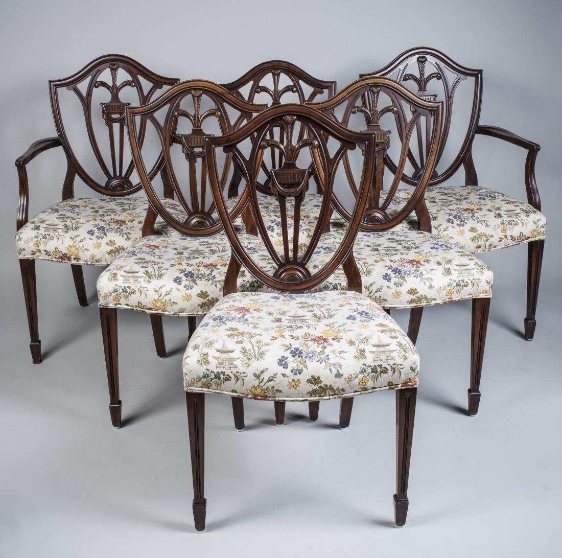 Set of Six Hepplewhite Style Shield Back Chairs: Comprising two armchairs and four side chairs, all with upholstered seats. Height 35 inches, width 21 inches, depth 19 inches. Notice to bidders: Condition reports and additional photographs are provi