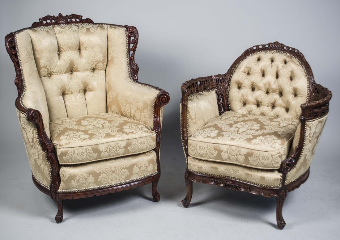 Two Upholstered Armchairs: Button tufted ivory silk damask upholstery, one with trapezoid back, the other oval back. Larger, height 41 inches, width 44inches, depth 34 inches. Notice to bidders: Condition reports and additional