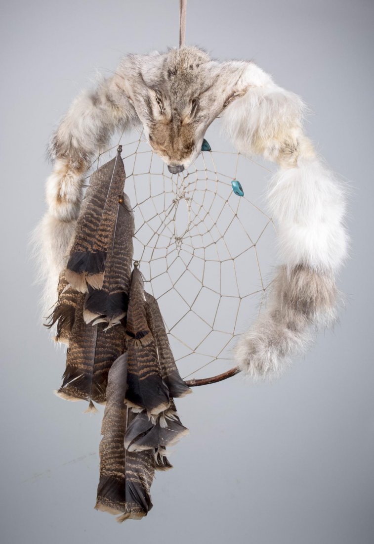 Native American Dream Catcher: With fox pelt, turkey feather, and turquoise bead decoration. Diameter 18 inches. Notice to bidders: Condition reports and additional photographs are provided by request as a courtesy to our clients, 