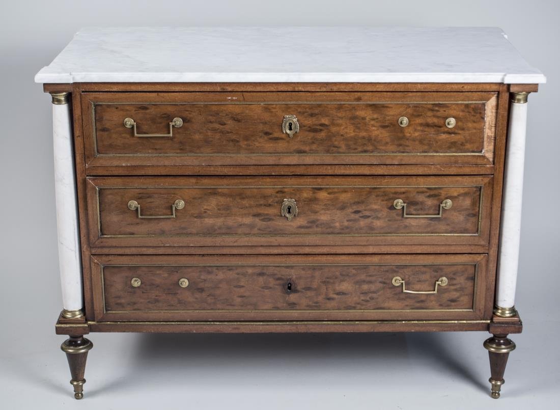 Louis XVI Style Marble Top Commode *: 19th century, neoclassical style, white marble top over three drawers, flanked by white marble columns, on toupie feet. Height 31 inches, width 41 inches, depth 20 inches. Notice to bidders: Condition