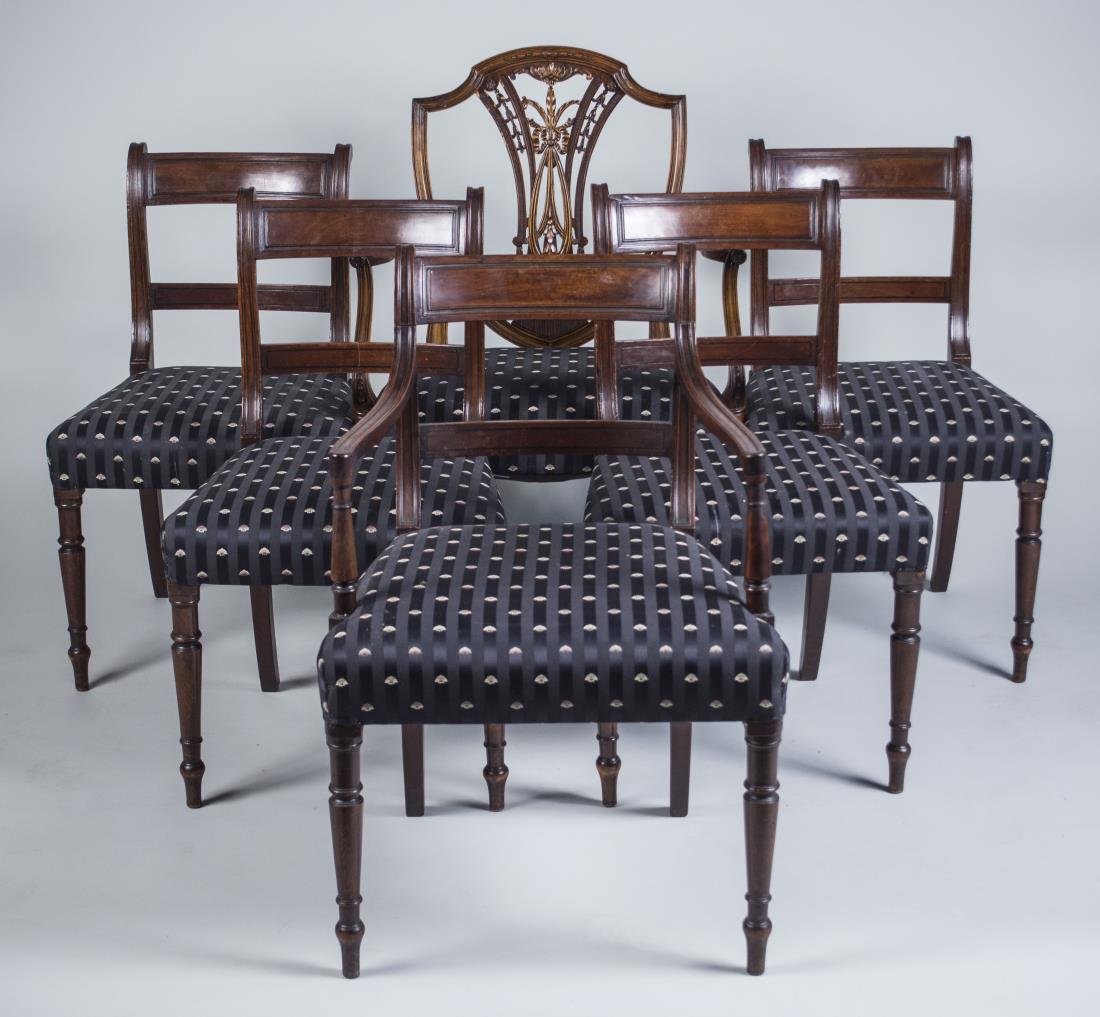 Set of Mahogany Dining Room Chairs: Regency style, including one armchair and six side chairs, together with a Hepplewhite style shield back armchair. Height 40 inches, width 26 inches, depth 22 inches. Notice to bidders: Condition repo