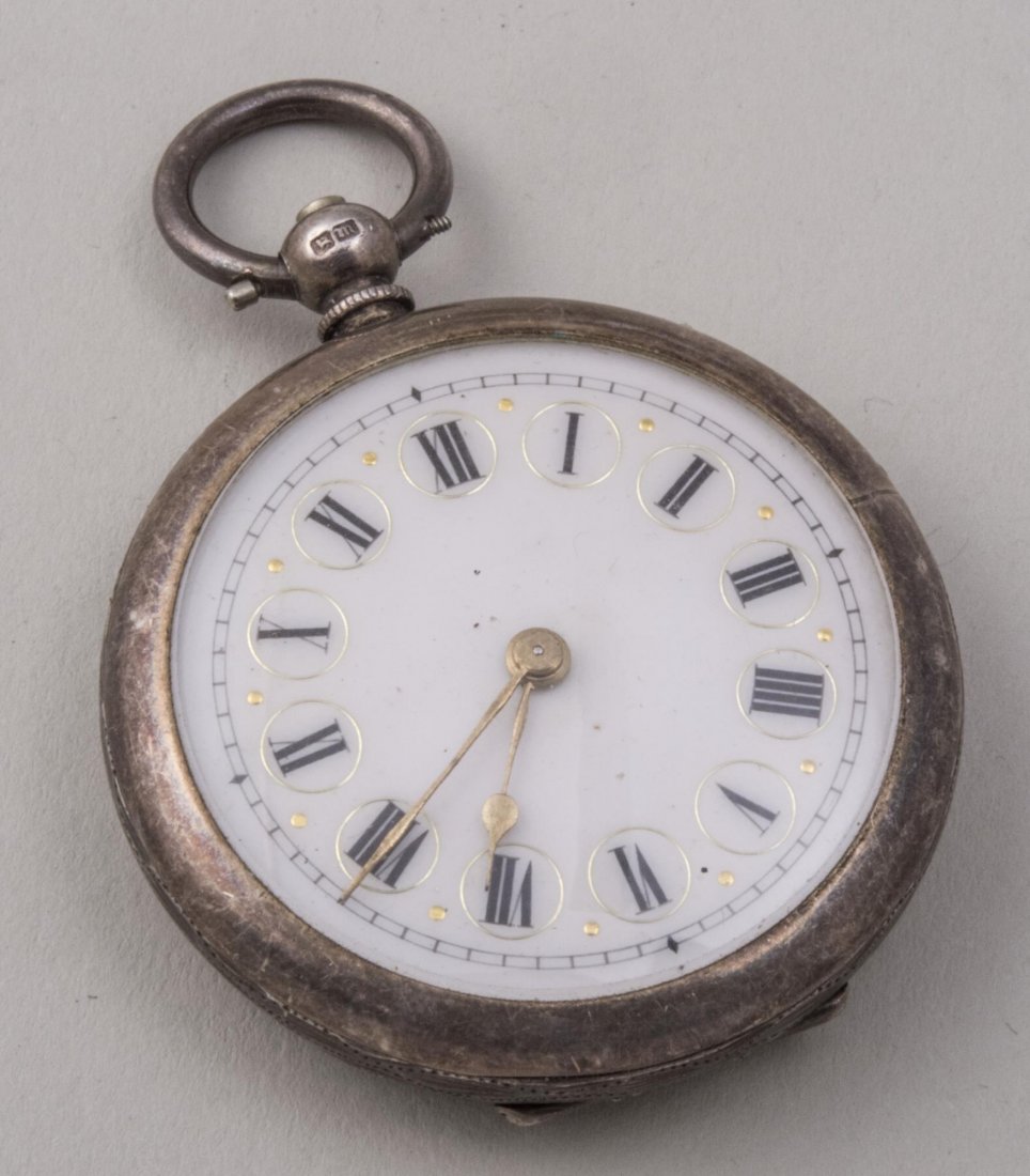 English Silver Pocket Watch: Key wind watch, the engraved case with maker's mark FP, Birmingham, 1911, enamel dial with Roman numerals. Diameter 1 5/8 inches. Notice to bidders: Condition reports and additional photographs are pr