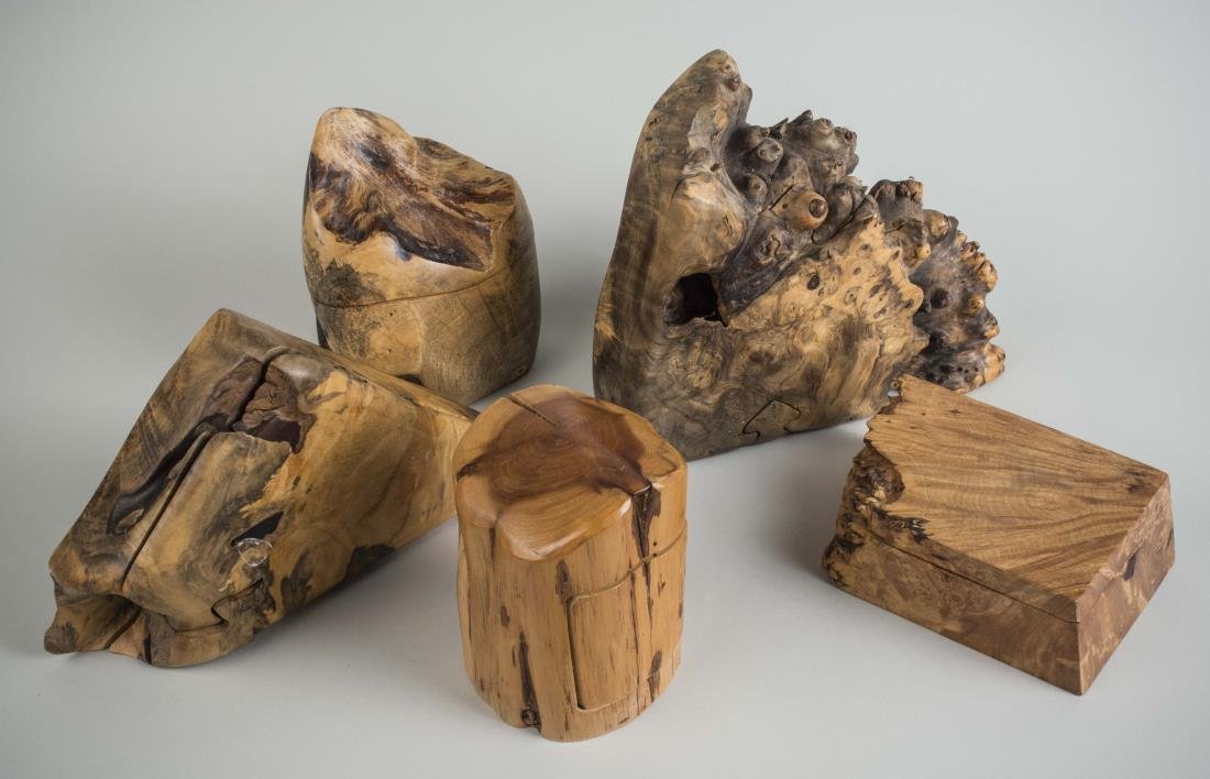 Group of Puzzle Boxes: Two signed Richard Rothbard, another signed Michael Elkan, another signed R.R. Sugar Leaf, and one signed with a cypher. Natural wood forms, various sizes. Largest, length 11 inches. Notice to bidders