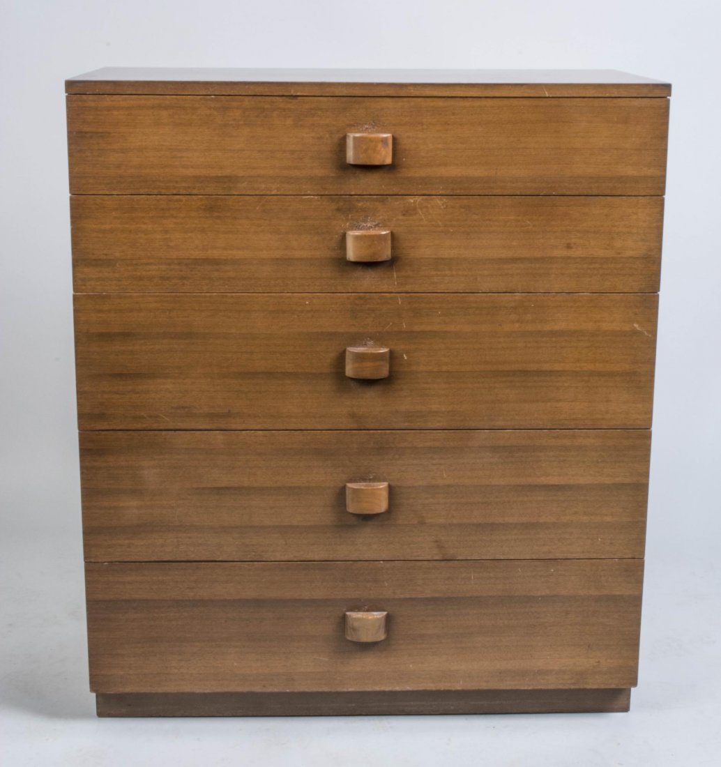 Gilbert Rohde for Herman Miller Chest: Walnut chest with rectangular top over five graduated drawers, plinth base, foil label inside drawer. Height, 42 inches, width, 36 inches, depth, 17 inches. Notice to bidders: Condition reports and ad